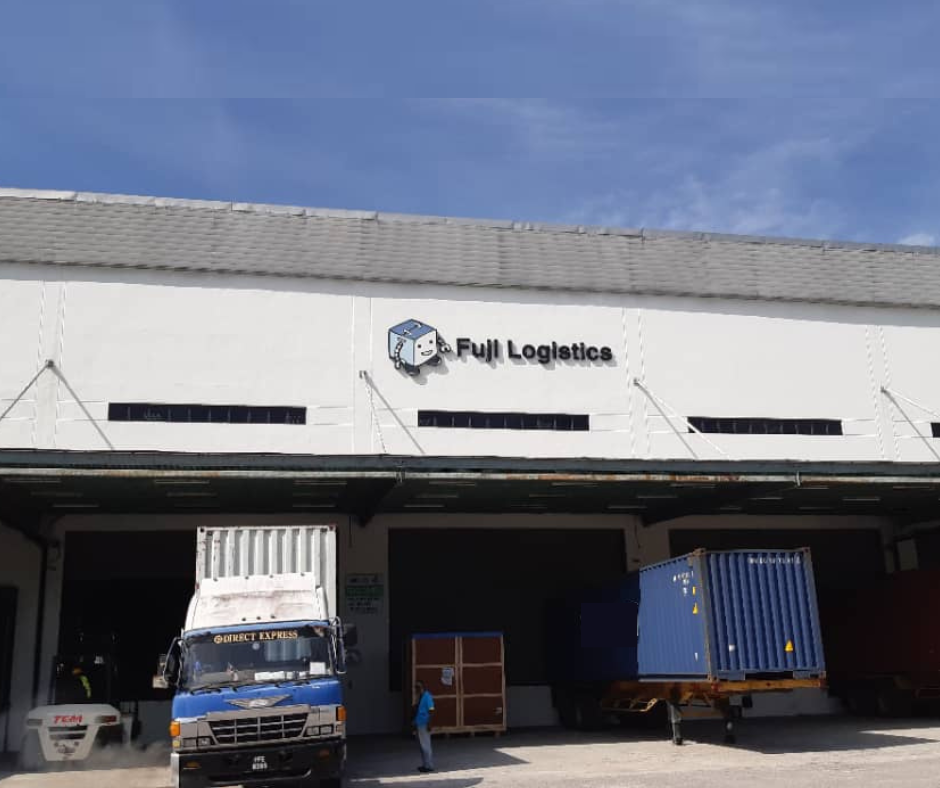 Trucks loading and unloading cargo from the loading bay .